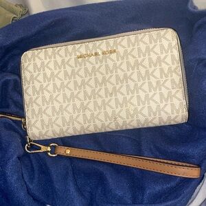 Michael kors wallet. Wristlet with no damage or rips. Perfect condition